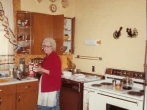 My grandma standing in her kitchen in the 1980's.