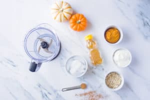 Ingredients for pumpkin pie smoothies laid out on countertop