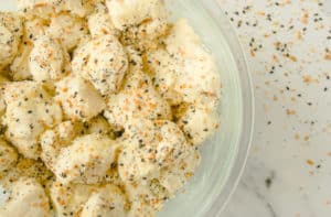 Clear bowl of biscuit pieces with Everything Bagel Seasoning
