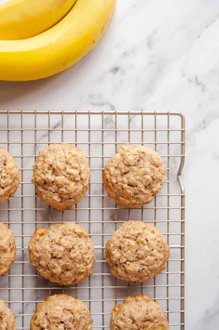 Banana Oatmeal Cookies on wire rack next to whole bananas