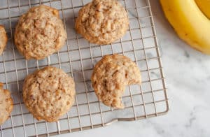 Banana Oatmeal Cookies on wire rack with one with a bite taken out