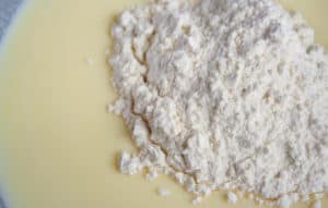 flour mixture on top of egg and buttermilk mixture