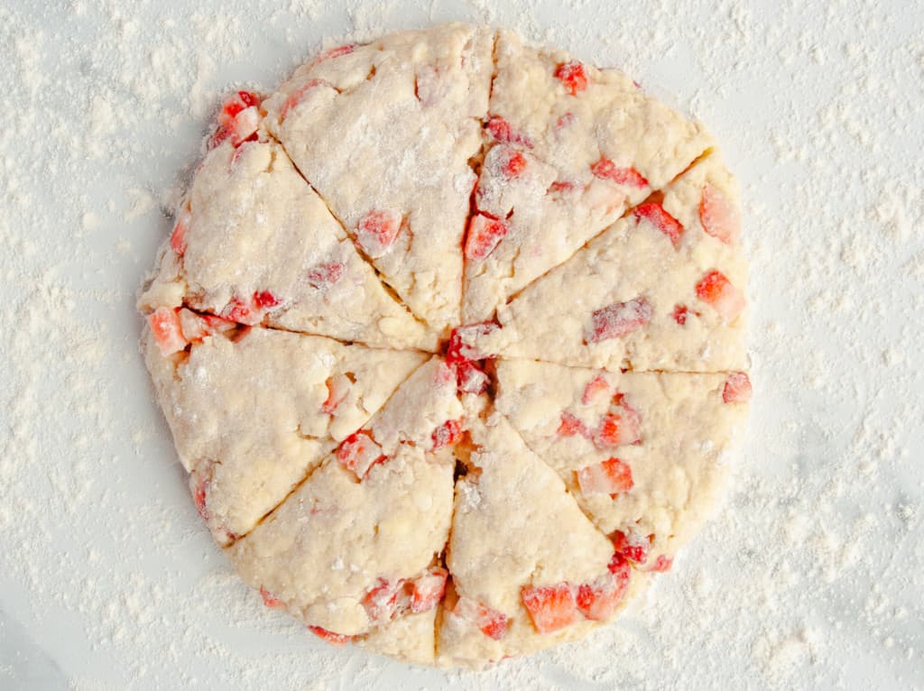 Circle of scone dough cut into 8 triangles
