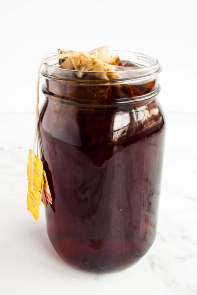 Steeped black tea in a mason jar