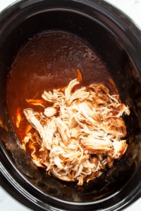Shredded chicken in the slow cooker with bbq ranch sauce