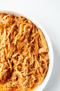 Slow Cooker BBQ Ranch Chicken in a white dish