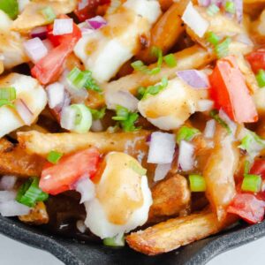Overhead shot of Poutine Fries in black pan