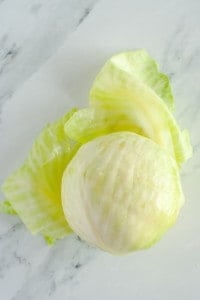Boiled head of cabbage with leaves peeling away