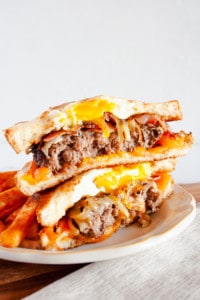 Brunch Patty Melt Sandwich cut in half with one half stacked on the other