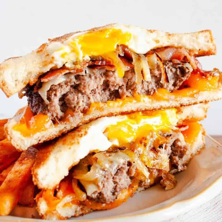 Brunch Patty Melt Sandwich cut in half with one half stacked on the other