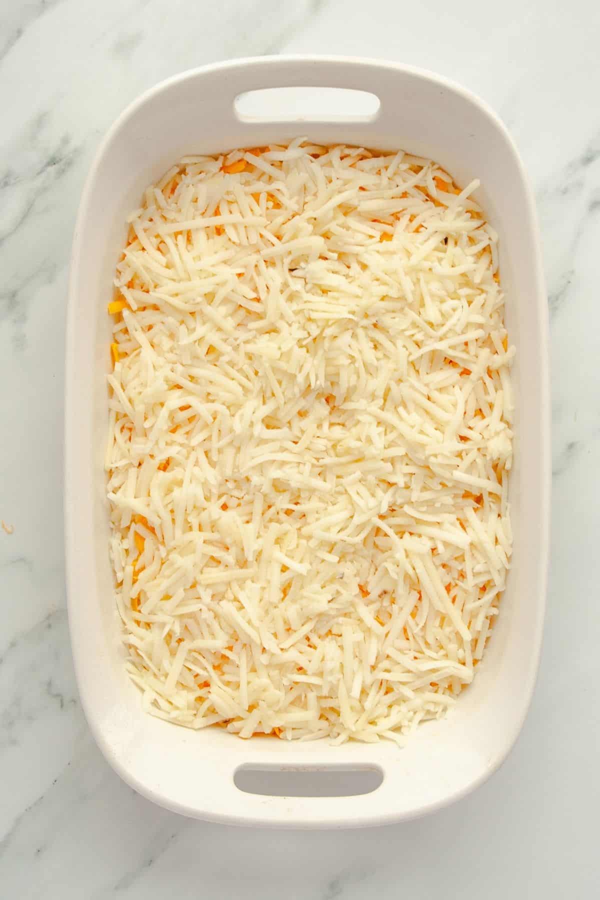 Second layer of hashbrowns in baking dish