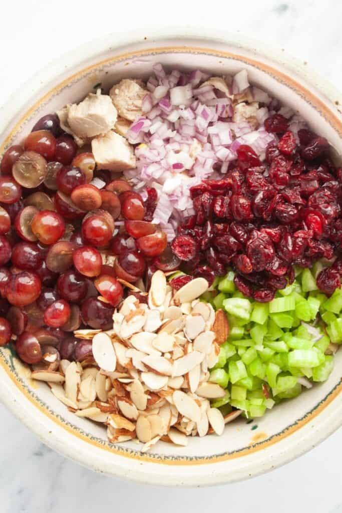 Components of chicken salad separated in a bowl