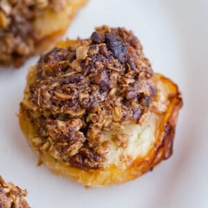 Close up of baked apple with oat crumble topping