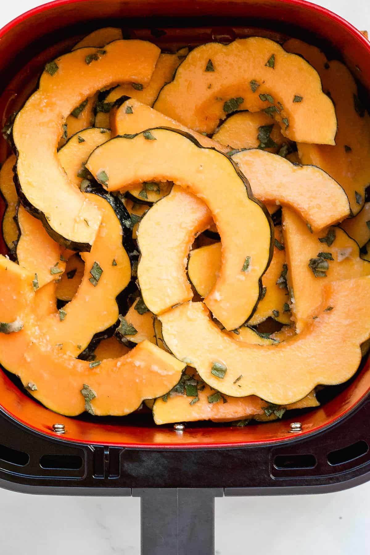 Squash slices in the air fryer basket