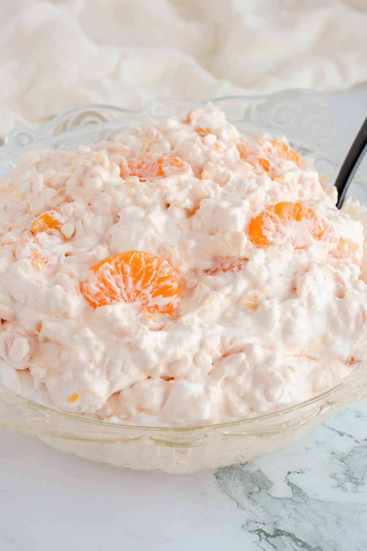 Jello salad in a clear glass bowl