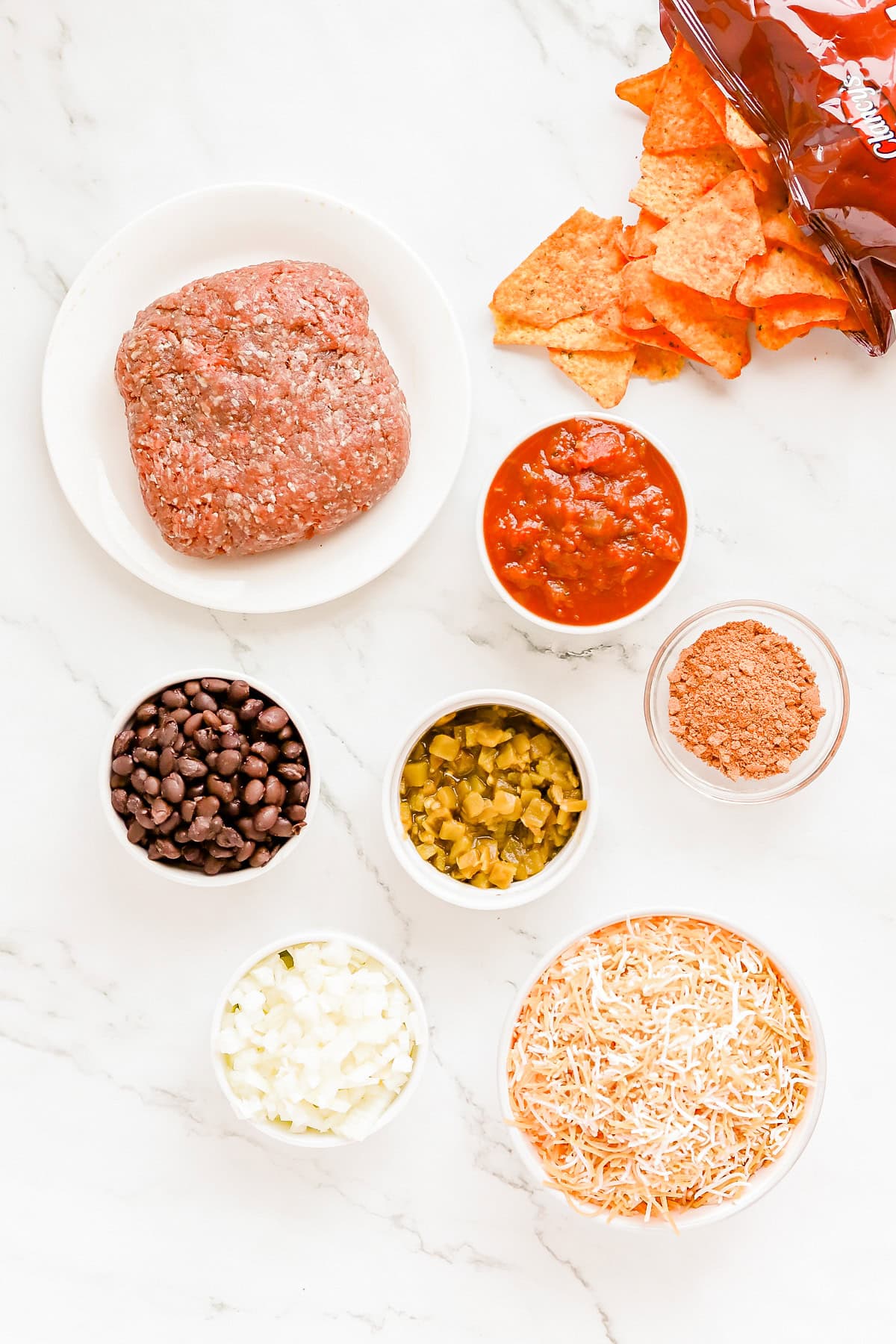 Walking taco ingredients on countertop.