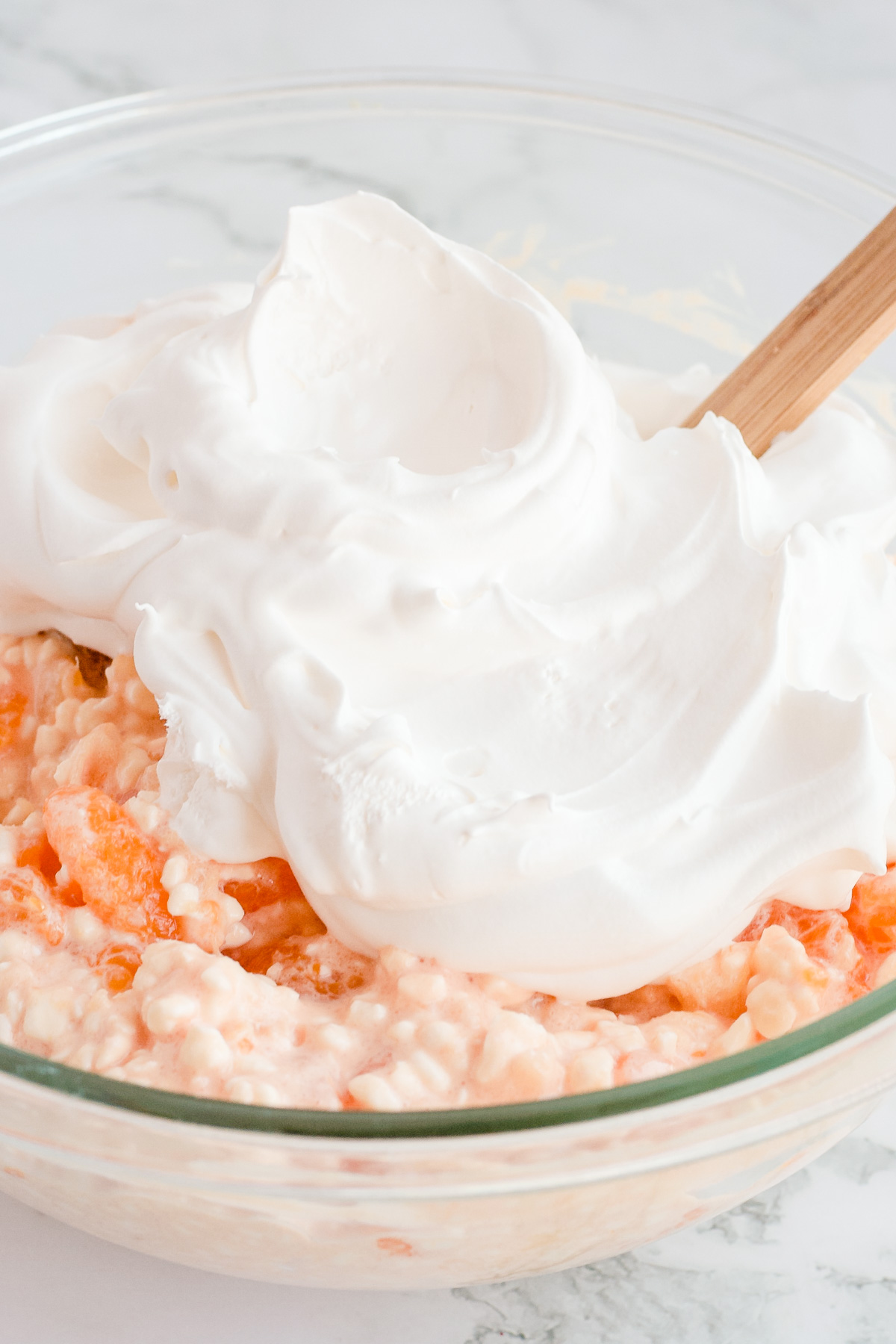 Whipped topping on top of salad ready to fold in