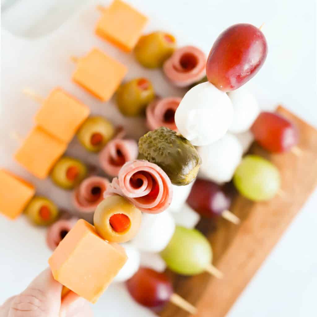 Square photo of charcuterie skewer.
