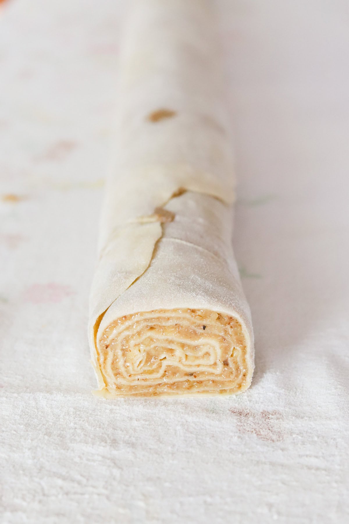Rolled potica on cotton tablecloth.