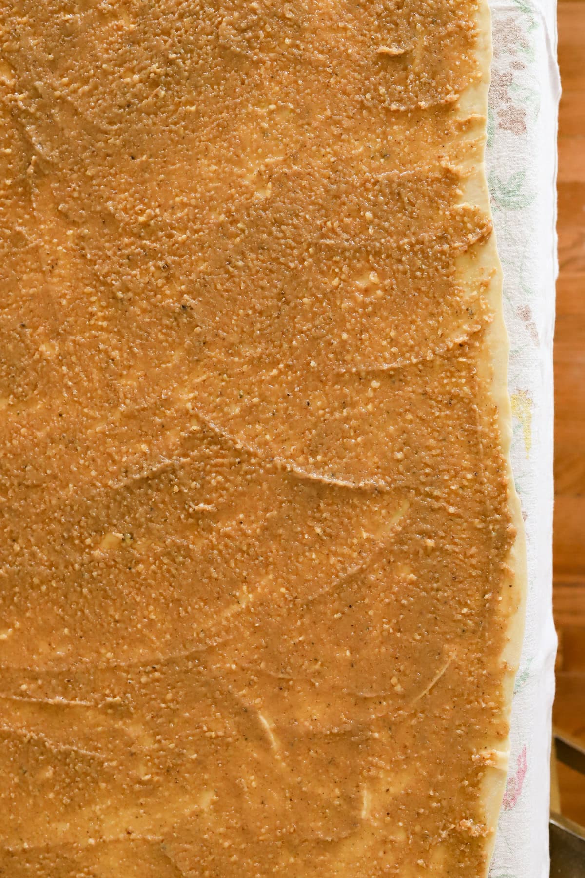 Walnut honey filling spread in a thin layer across potica dough
