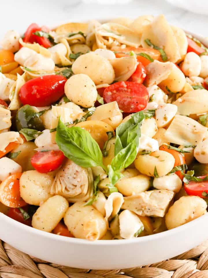 Featured image of italian gnocchi salad in a white dish.