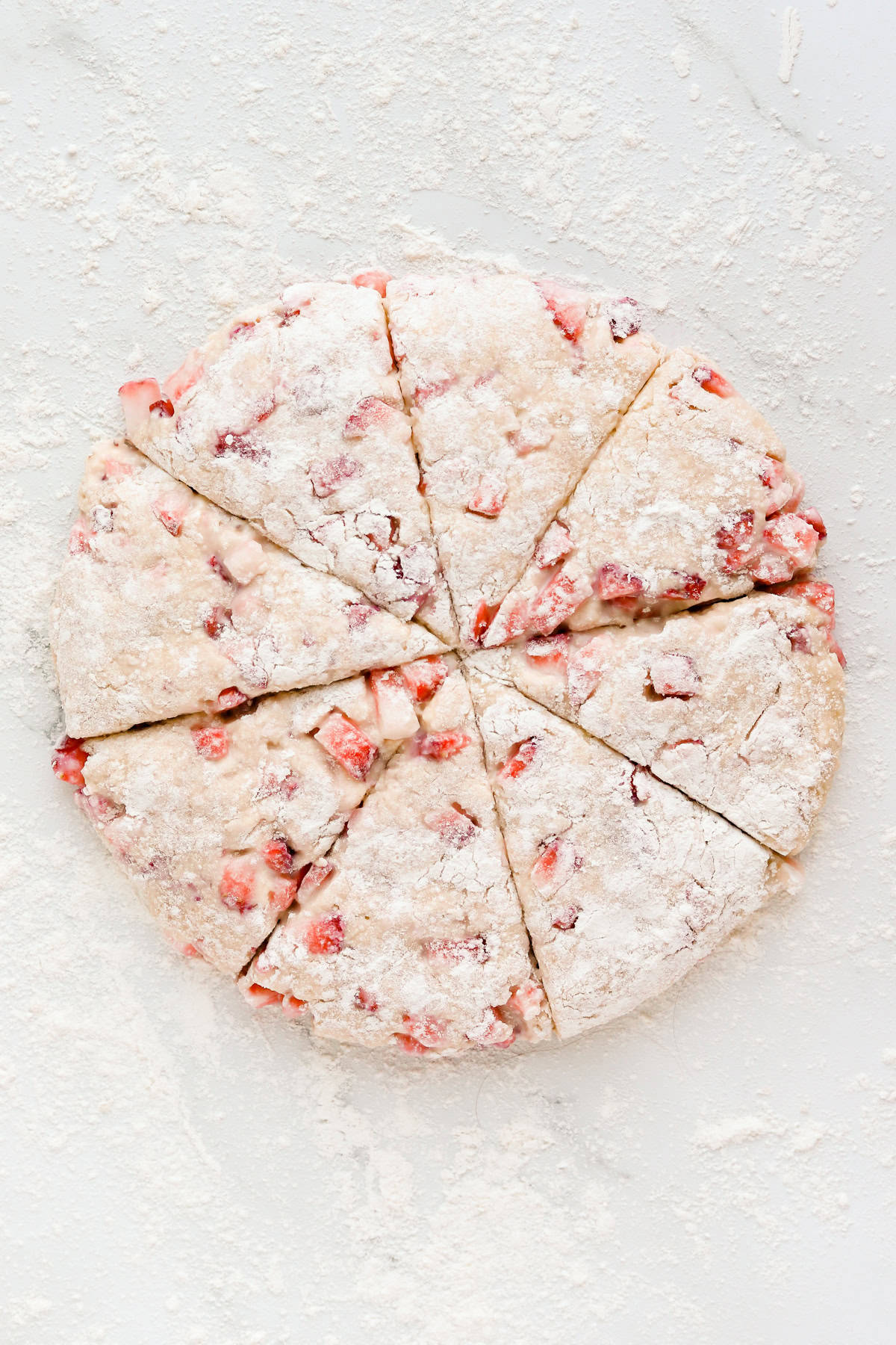 Disc of scone batter cut into 8 triangles.