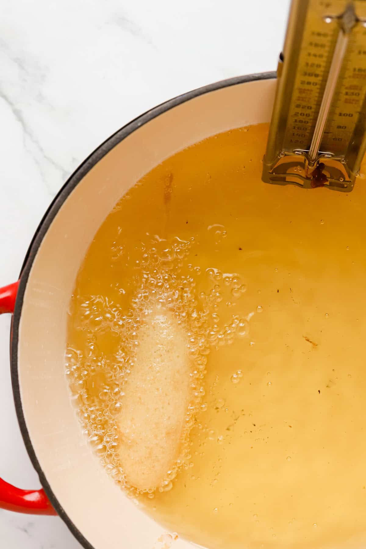 Hot oil in a dutch oven with thermometer