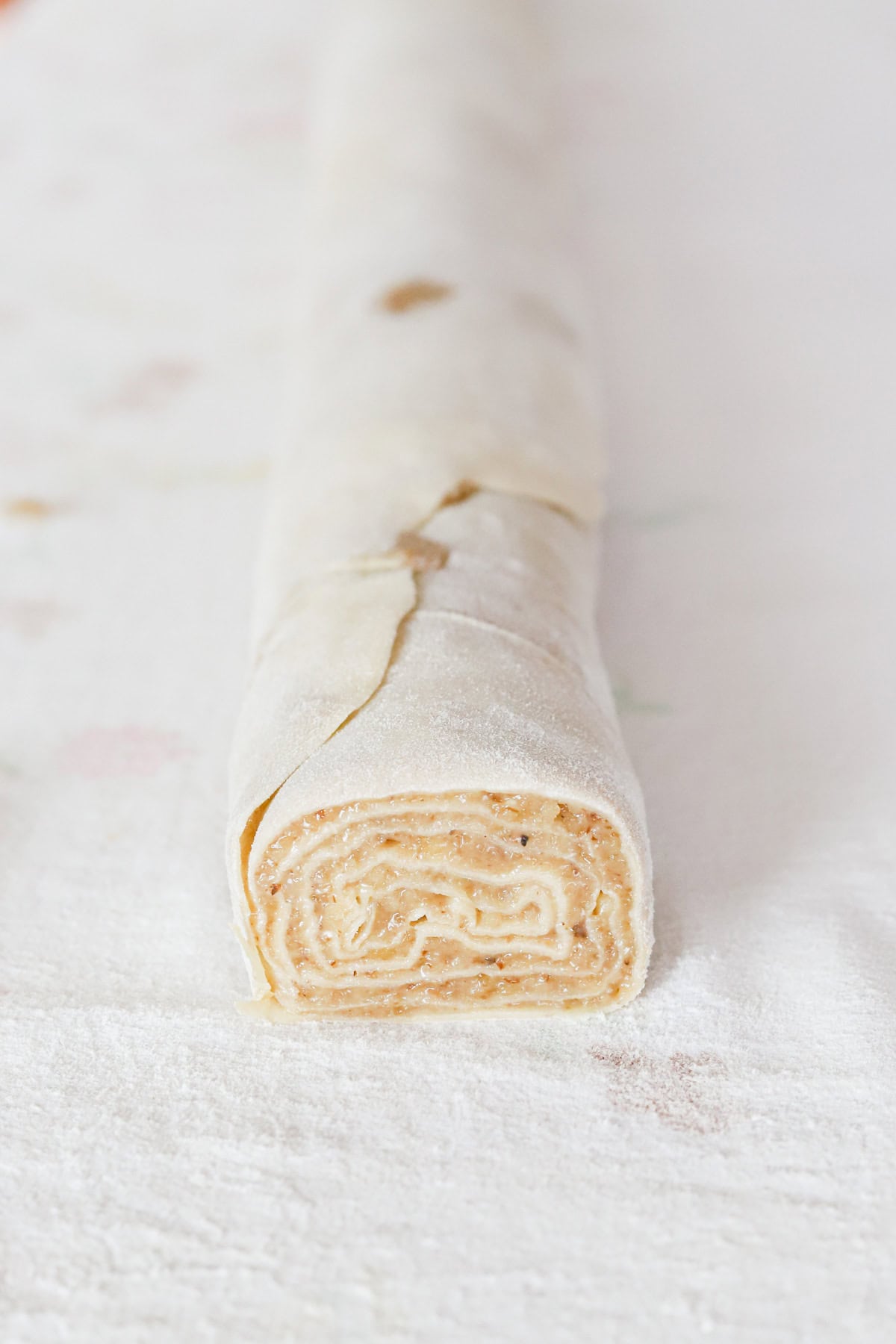 Rolled potica on cotton tablecloth.