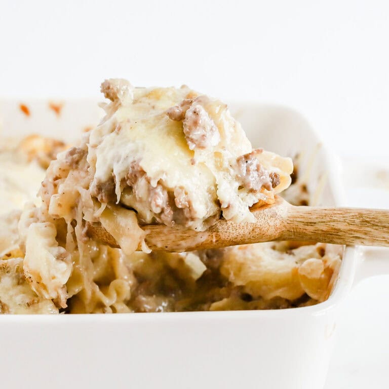 Featured image of wooden spoon of sauerkraut casserole.