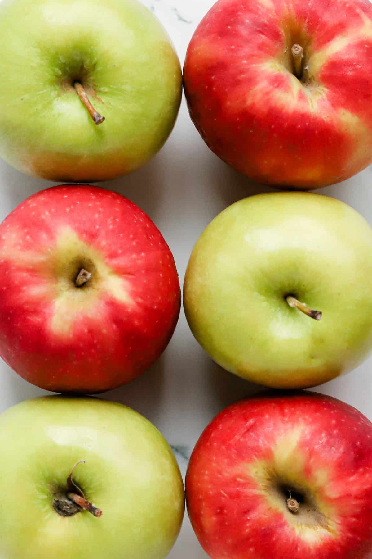 Red and green apples on countertop