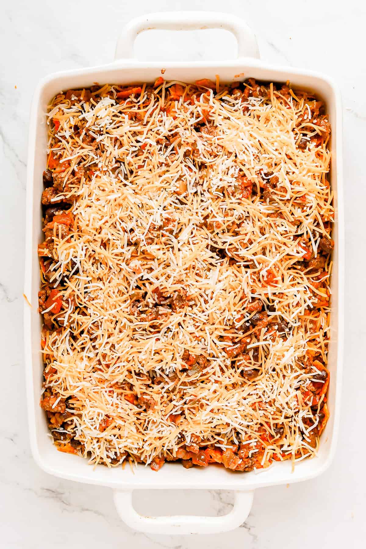 Second layer of cheese on top of casserole.