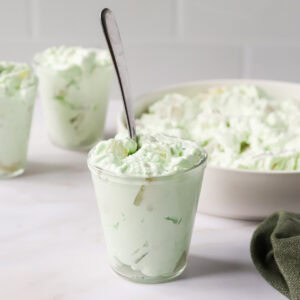 Featured image of lime jello salad in glass jars.
