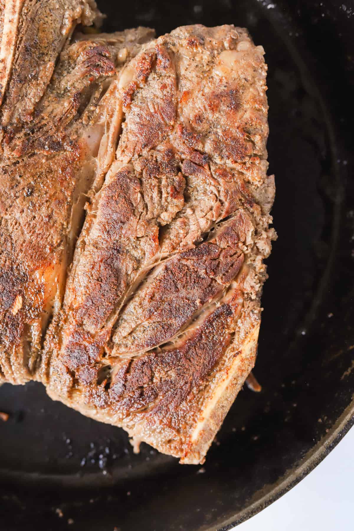 Seared chuck roast in cast iron skillet